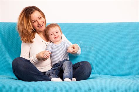 Happy Smiling Mother And Her Son On The Couch Stock Image Image Of