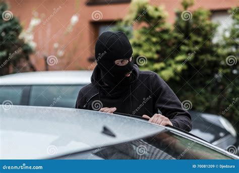 Car Thief Entering The Vehicle And Stealing A Car Stock Image Image