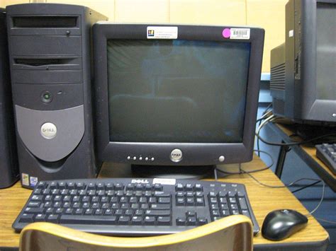 The desk is dusty and looks to have been discarded. How Computer Recycling Works: What to Do With Your Old Desktop