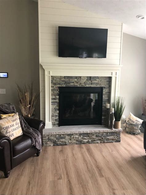 Before you ask, yes the 'stones' are very realistic looking. Shiplap Fireplace Wall Accented with Stacked Stone Style ...