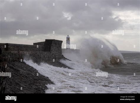 Stormy Seas Batter Lighthouse And Breakwater At The Entrance To