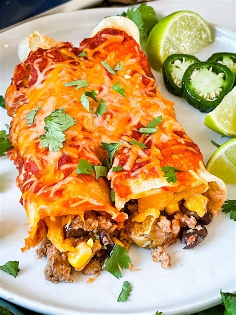 these southwest ground turkey enchiladas are packed with cheese turkey black beans corn and
