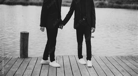 Zdjęcie Stock European Gay Couple Holding Hands Wearing Black Suits Wedding Day Of A Same Sex