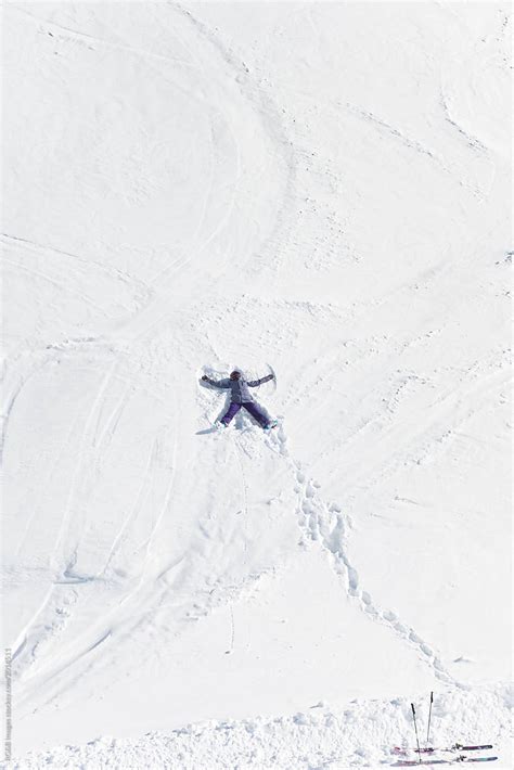 Female Skier Making A Snow Angel Stock Image Everypixel