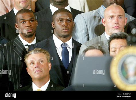 Reggie Bush Running Back For The New Orleans Saints Us President Barack Obama Holds A