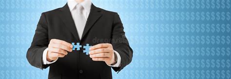 Man Matching Puzzle Pieces Over Business Team Stock Photo Image Of