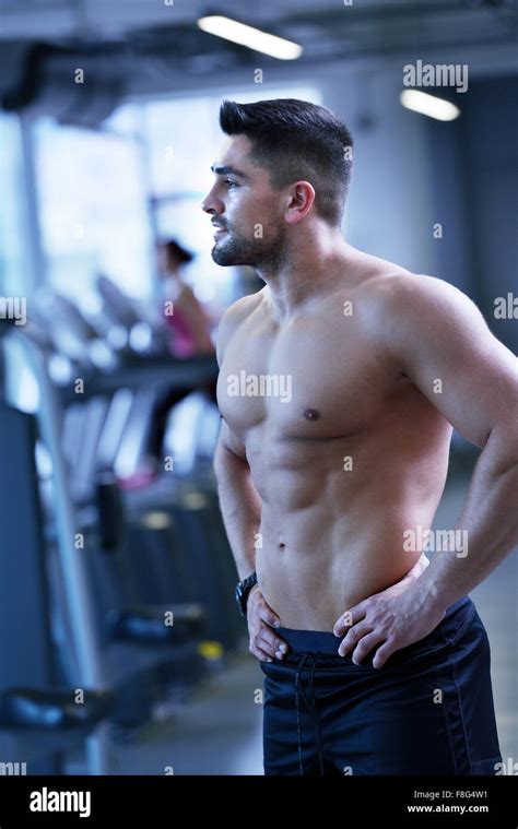 Strong Handsome Man Exercising At The Gym Stock Photo Alamy