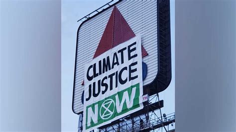 Climate Justice Now Banner Hung Over Bostons Citgo Sign