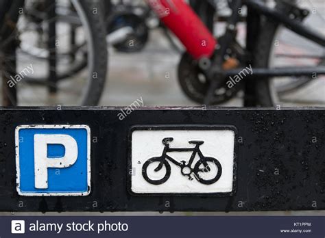 Blue And White Cycle Parking Sign With Black And White Bicycle And Out