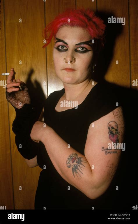 punk girl with red hair and tattoo at a sigue sigue concert newcastle upon tyne 1986 homer sykes