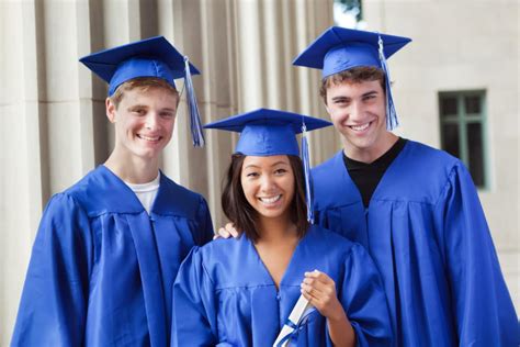 Group Of Happy Teenagers Holding Diploma In High School Graduation