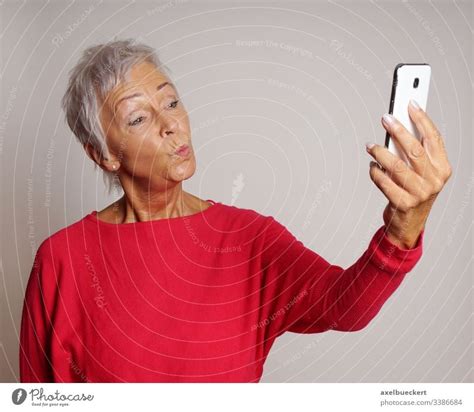 Mature Woman Taking A Selfie With Smartphone A Royalty Free Stock