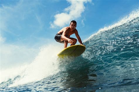 Low Angle Shot Of A Man Surfing · Free Stock Photo