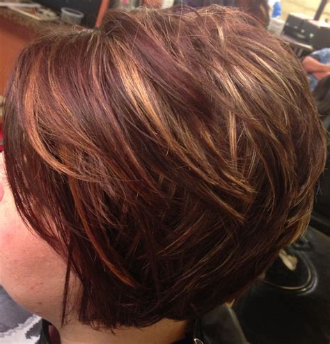 Asymmetrical, inverted bob, caramel highlights. Short hair.....I had