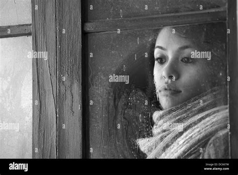 Portrait Of A Beautiful Woman Behind Window Stock Photo Alamy