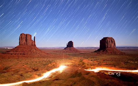 Night Sky And Lights In Monument Valley Navajo Tribal Park Wallpaper