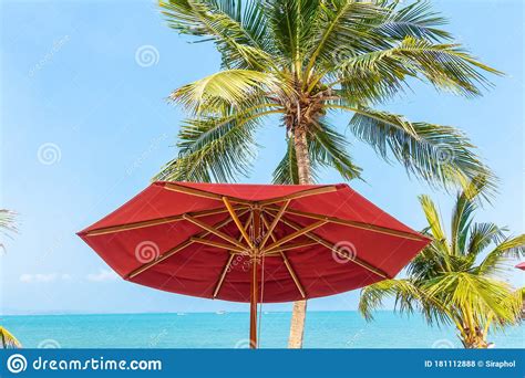 Beautiful Tropical Beach Sea Ocean With Umbrella And Chair Around