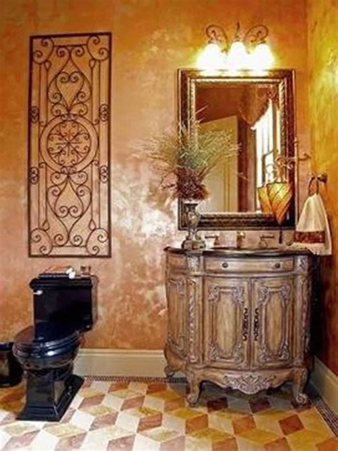 Tuscan Bathroom Design With Black Toilet And Wrought Iron Wall Decor