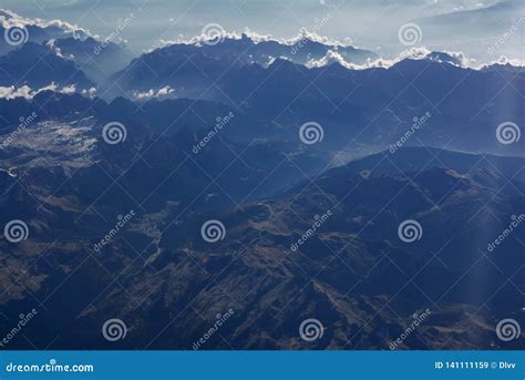 Aerial View Of Misty Mountains And Clouds Above The Mountain Peaks