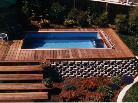 Typically we leave boxes from the new pool stacked neatly in your yard or on the curb for trash pickup. An above-ground Endless Pool, surrounded by container and ...