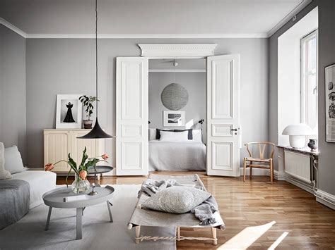 The soft gray wall color is the perfect. Light flooded home in grey | Living room grey, Light grey ...