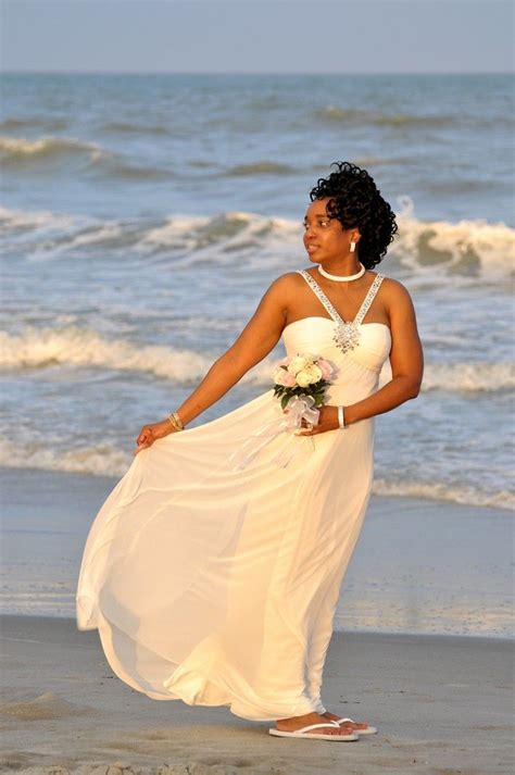 Beautiful Bride And Beautiful Dress Flowing With The Beach Breeze