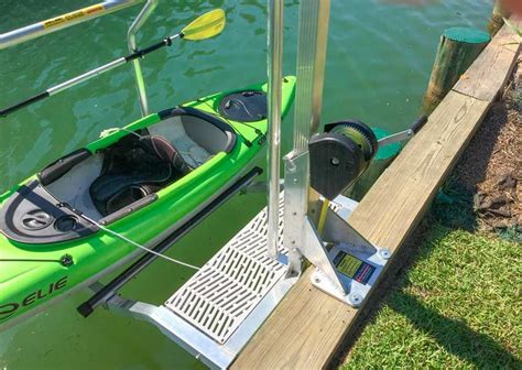 A Green Kayak Is Tied To The Dock