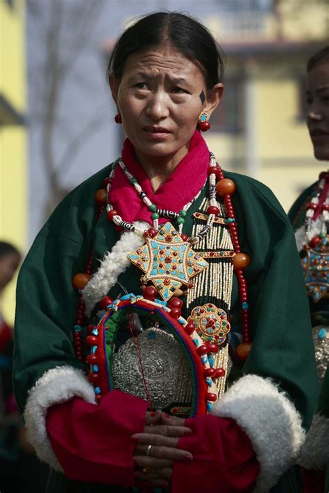 A Tibetan Woman Dressed In Traditional Costume