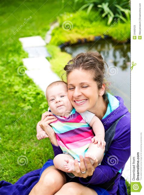 Mother With Her Baby Have Fun Near The Lake Stock Image Image Of