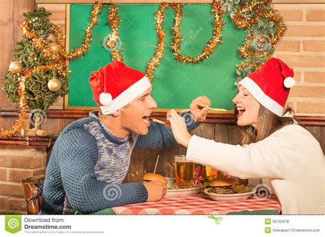 There are no holidays without delicious meals typical of this or that country. Young Couple Flirting With American Food At Christmas ...