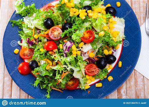 Salad With Lettuce Tomato Corn And Olives Stock Photo Image Of