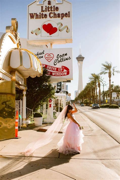 A Woman In A Wedding Dress Walking Down The Street