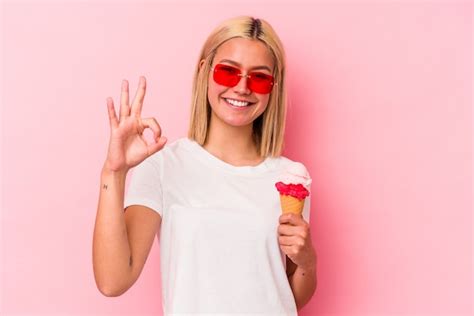 Premium Photo Young Venezuelan Woman Eating An Ice Cream Isolated On Pink Wall Cheerful And