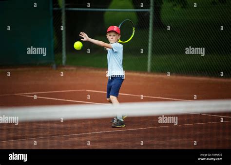 Boy Playing Tennis Stock Photo Alamy