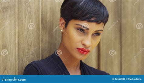 Close Up Of African Woman In Black Dress And Red Lipstick Leaning