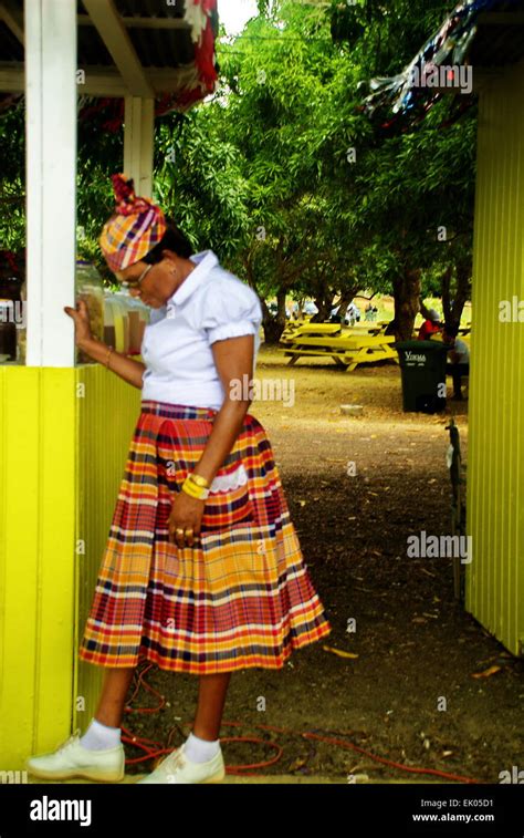 Caribbean Woman Dressed In Traditional Clothing For The Island Of St