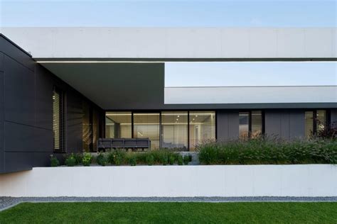 Minimalist Concrete House Design With A Patio And Large Terraces • 333