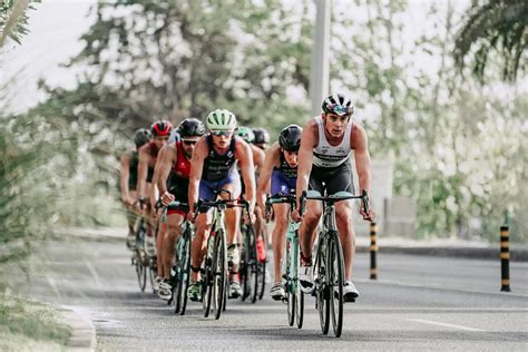 Strong Muscular Cyclists Competing On Road · Free Stock Photo