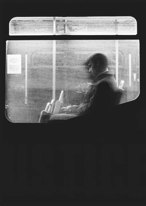 Download Man Sitting Alone In Subway Train Wallpaper