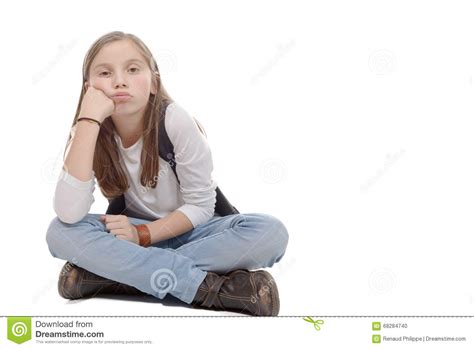 Preteen In Jeans Boots Hat And T Shirt Sitting On The Floor Stock