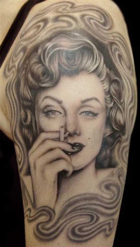 Nice Natural Looking Colored Shoulder Tattoo Of Smoking Merlin Monroe