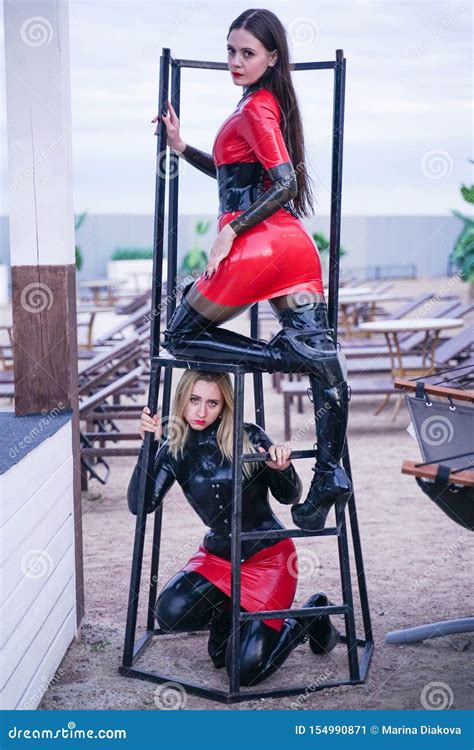 Dominant Woman With Her Slavegirl Outdoor Shows Exhibitionism Stock Image Image Of Game