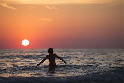 Free Images Beach Sea Coast Water Sand Ocean Horizon Person Sky Sun Sunrise Sunset