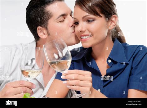 Man Kissing A Woman On Cheek Stock Photo Alamy