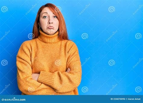 Beautiful Redhead Woman With Arms Crossed Gesture Depressed And Worry