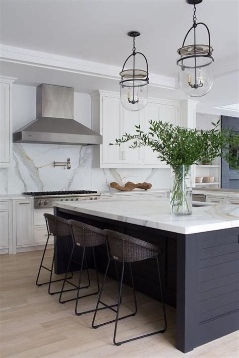 Shaker mahogany and shaker xpresso kitchen. Well appointed black and white kitchen features a black shiplap island contrasted with a ...