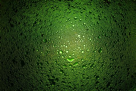 Green Oil Droplets From A Mixture Of Water And Olive Oil Illuminated