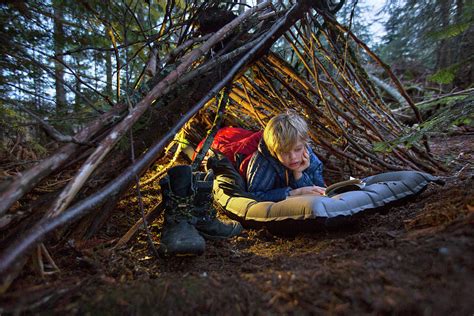 Boy Reading Book While Camping Photograph By Woods Wheatcroft Pixels