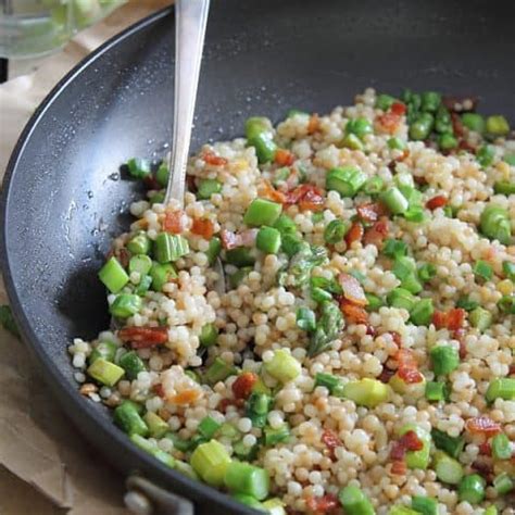 Place the couscous into a large bowl and add hot chicken or vegetable stock. Bacon and Asparagus Fried Couscous - Running to the Kitchen®