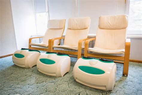 Three Empty Foot Massage Chairs In A Spa Cabinet Stock Photo Image Of